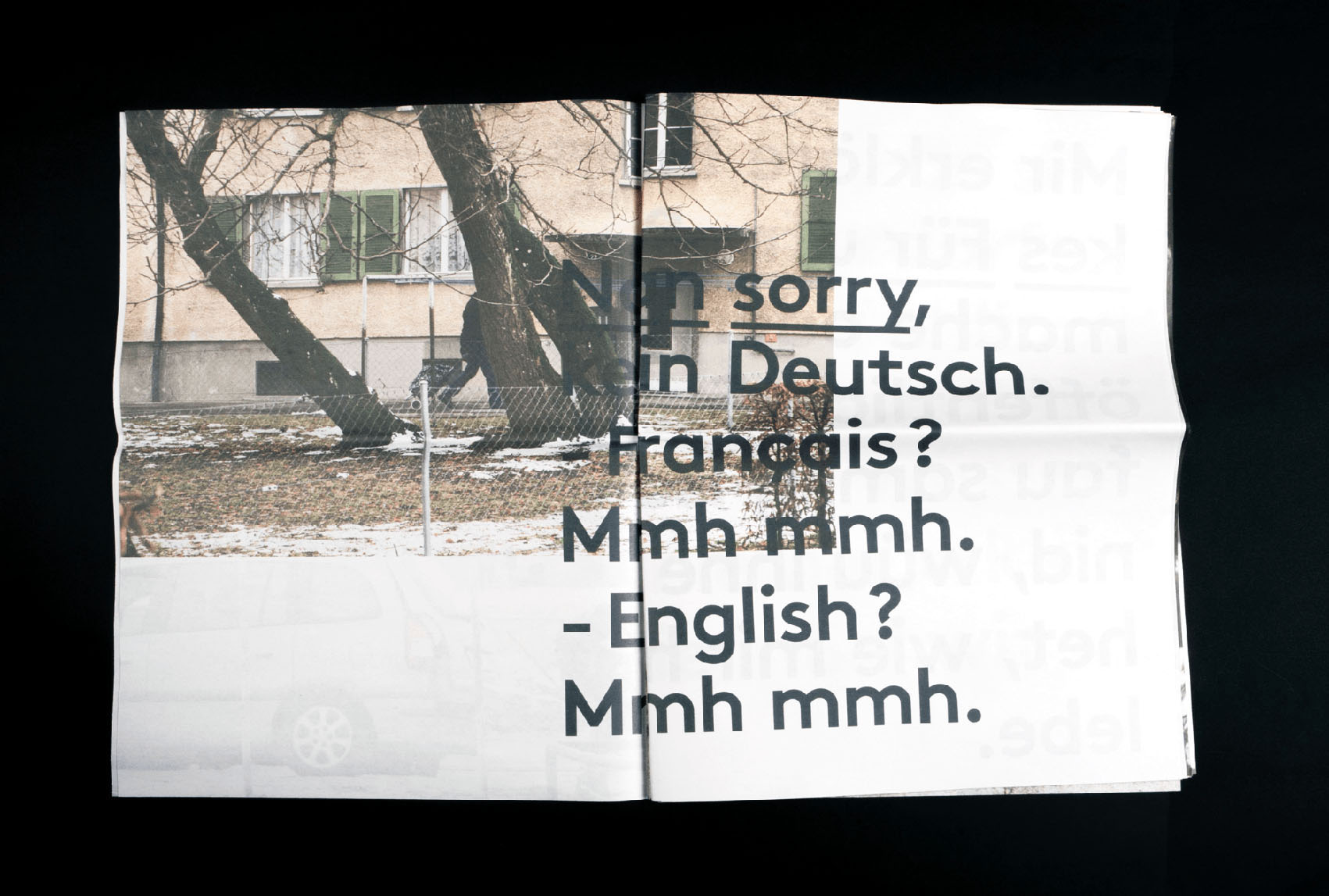 Page du journal avec image de Bern West et le texte; Nan, sorry, kein Deutsch. -Français ? Mmh mmh. -English ? Mmh mmh.